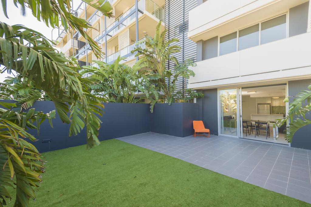 Eastwood Apartments Brisbane Exterior photo A private courtyard at a residential apartment in Australia